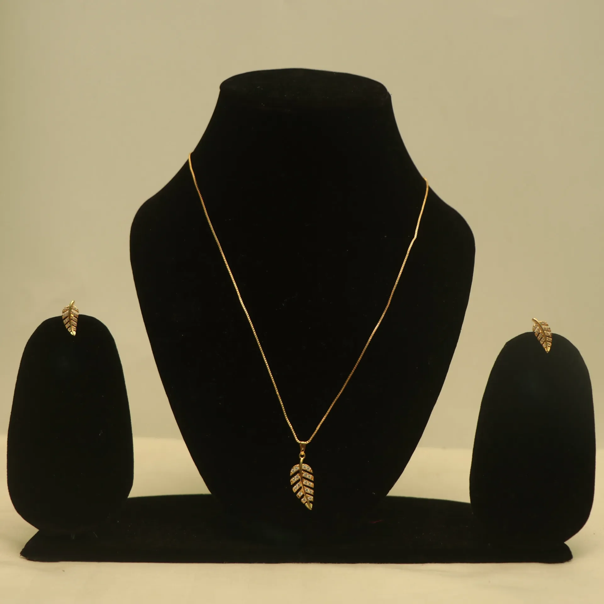 Arihant Crystal Leaf Charm & Matching Pendant Ans Necklaces Set