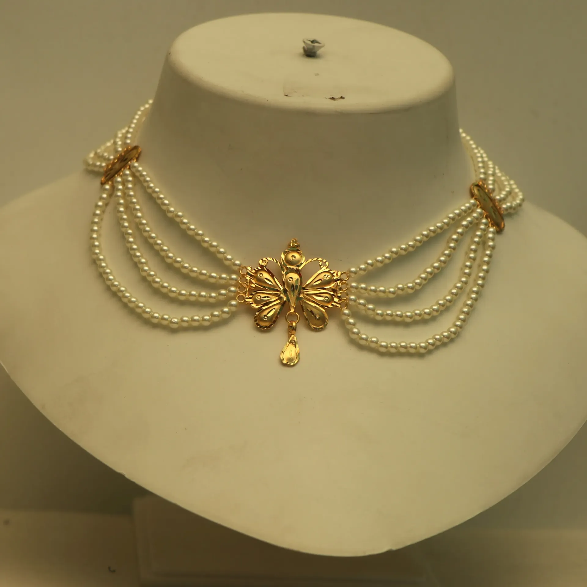 [NECKLACES-00435] Shreehari Butterfly Wings Gold-Plated 4-Row Pearl Choker